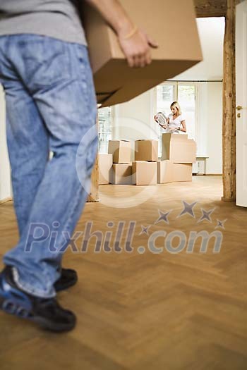 Man carrying a box to the flat Man carrying a box to the flat