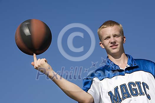 Boy spinning the ball on the finger