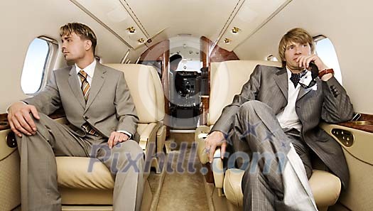 Two men travelling in the jet