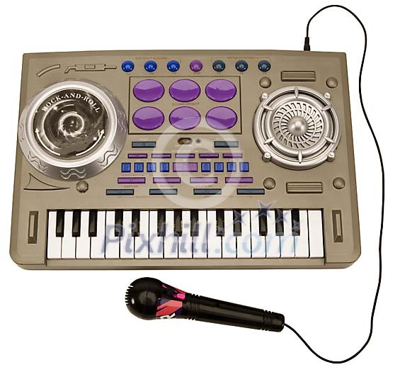 Isolated mini piano with a microphone Isolated mini piano with a microphone