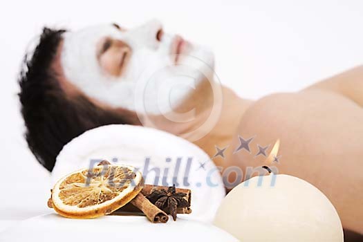 Man relaxing with a skincare mask on his face Man relaxing with a skincare mask on his face