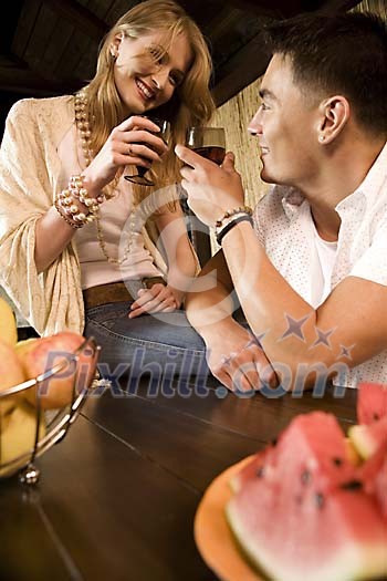 Couple having a glass of wine outside