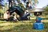 Camping cooker with a blurred people on the background