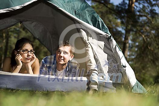 Couple looking through the tent door