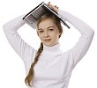 Girl standing , holding a laptop on her head