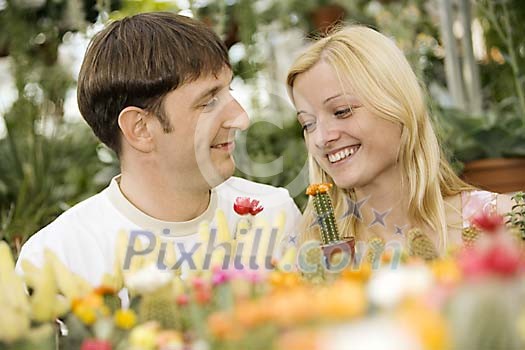 Couple at the flower shop by the cactuses