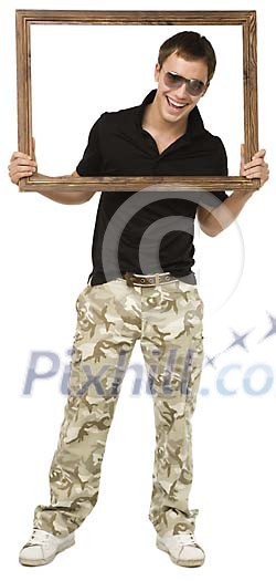 Isolated boy holding a picture frame