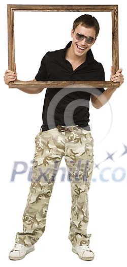 Isolated boy holding a picture frame Isolated boy holding a picture frame