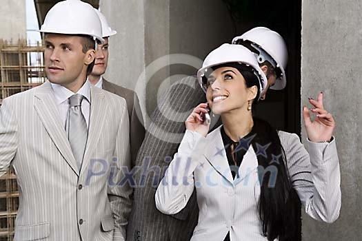 Men and a woman at the construction site