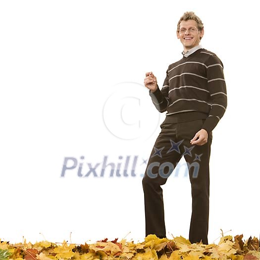 Man standing on the autumn leaves