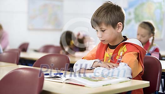 Young boy sitting in the classroom