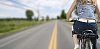 Woman biking on the motorway