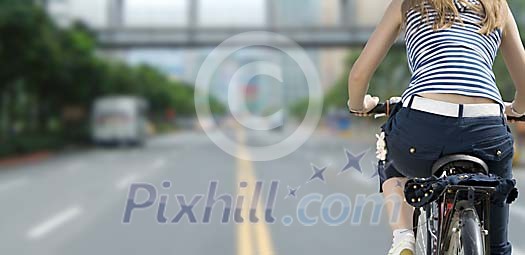 Woman biking in the city