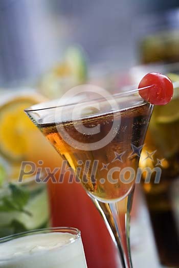 Cocktail with a cherry on the table Cocktail with a cherry on the table