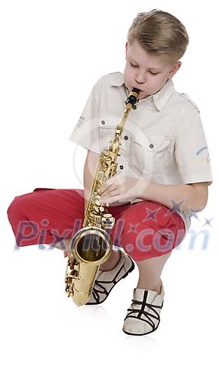 Isolated boy playing saxophone Isolated boy playing saxophone