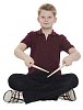 Isolated boy sitting on the floor with drumsticks