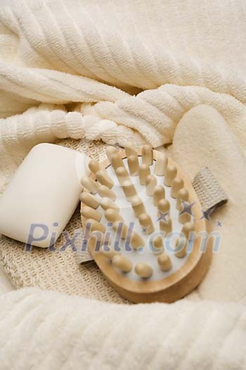 Soap, brush and a towel background