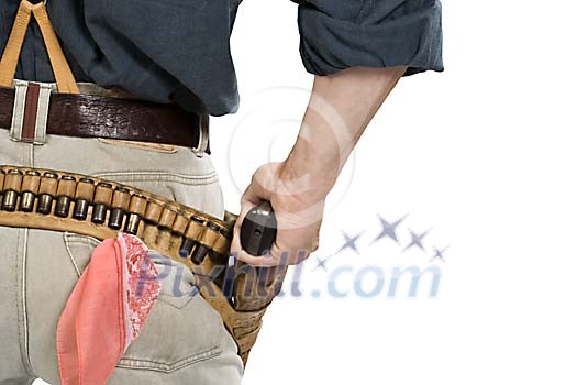 Cowboy holding his hand on the gun, ready to pull