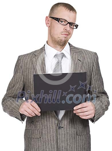Businessman looking unhappy, holding a black paper