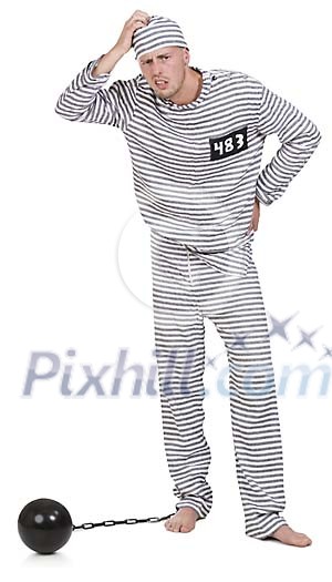 Isolated man dressed as a prisoner scratching his head