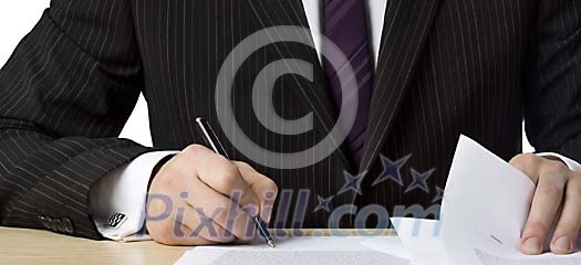 Businessman signing papers