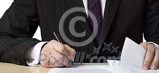 Businessman signing papers Businessman signing papers