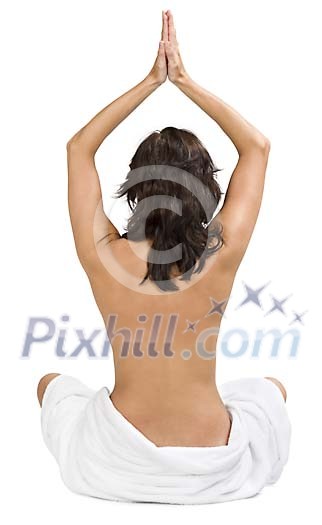 Isolated bare backed woman sitting on the floor