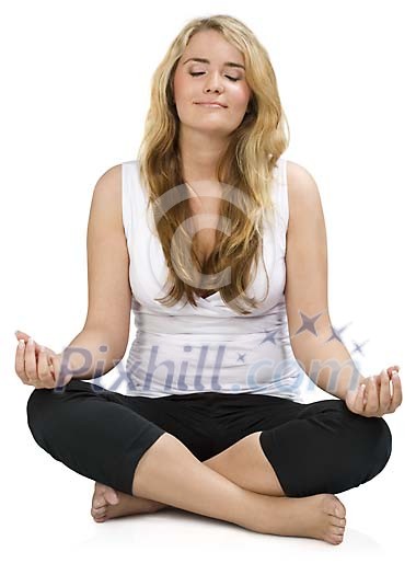 Isolated woman sitting on the floor meditating