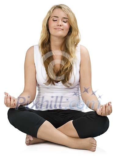 Isolated woman sitting on the floor meditating Isolated woman sitting on the floor meditating