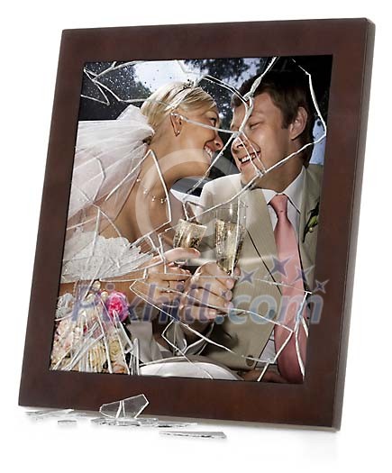 Wedding photo in a picture frame with broken glass