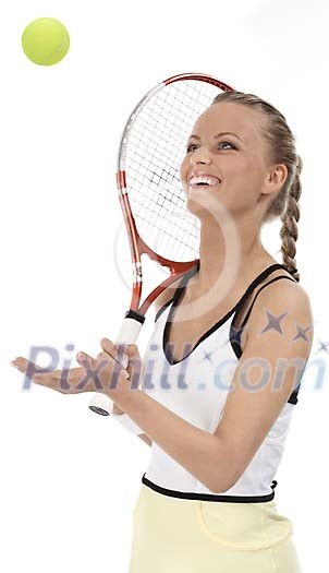 Isolated female tennis player hopping the ball
