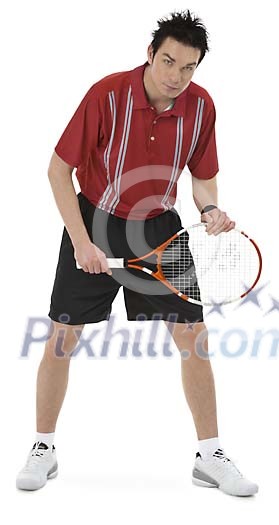 Isolated male tennis player ready to play