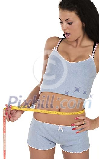 Isolated woman measuring her waist Isolated woman measuring her waist