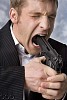 Businessman with a gun in his mouth