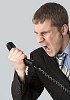 Businessman yelling to a phone