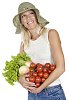 Isolated woman holding different vegetables in her hands
