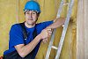 Male carpenter smiling at worksite