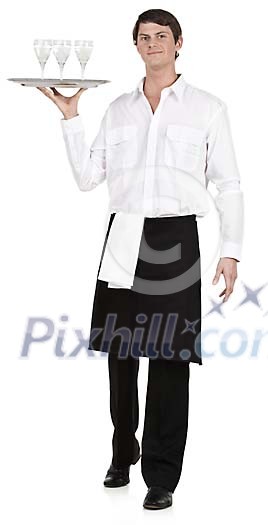 Isolated male waiter carrying a tray with glasses