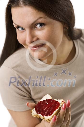 Woamn eating toast with jam Woamn eating toast with jam