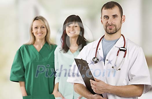 Male doctor with two female nurses