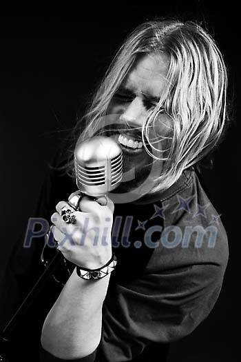 Black and white image of male singer singing Black and white image of male singer singing