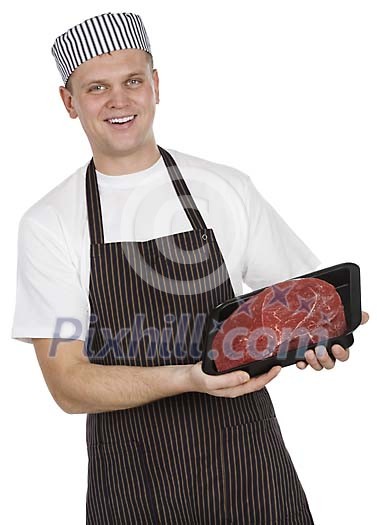 Isolated male butcher showing a piece of meat