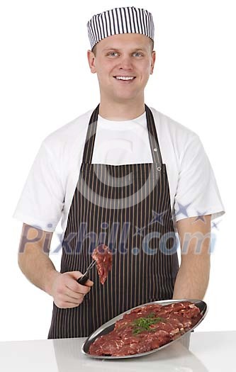 Isolated male butcher offering meat