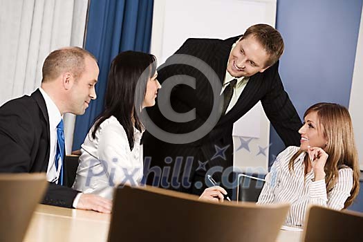 Men and women at a meeting Men and women at a meeting