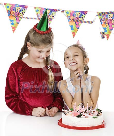 Girls with a birthday cake Girls with a birthday cake