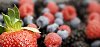 Background of strawberries, raspberries and blueberries