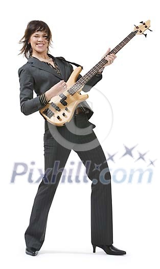 Isolated businesswoman playing a guitar