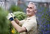 Older man with pot flowers