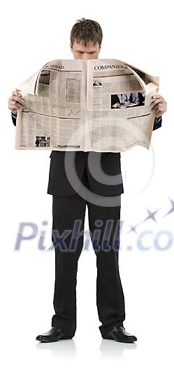 Isolated businessman reading newspaper