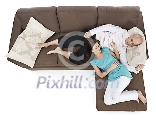 Isolated couple taking a nap on the couch